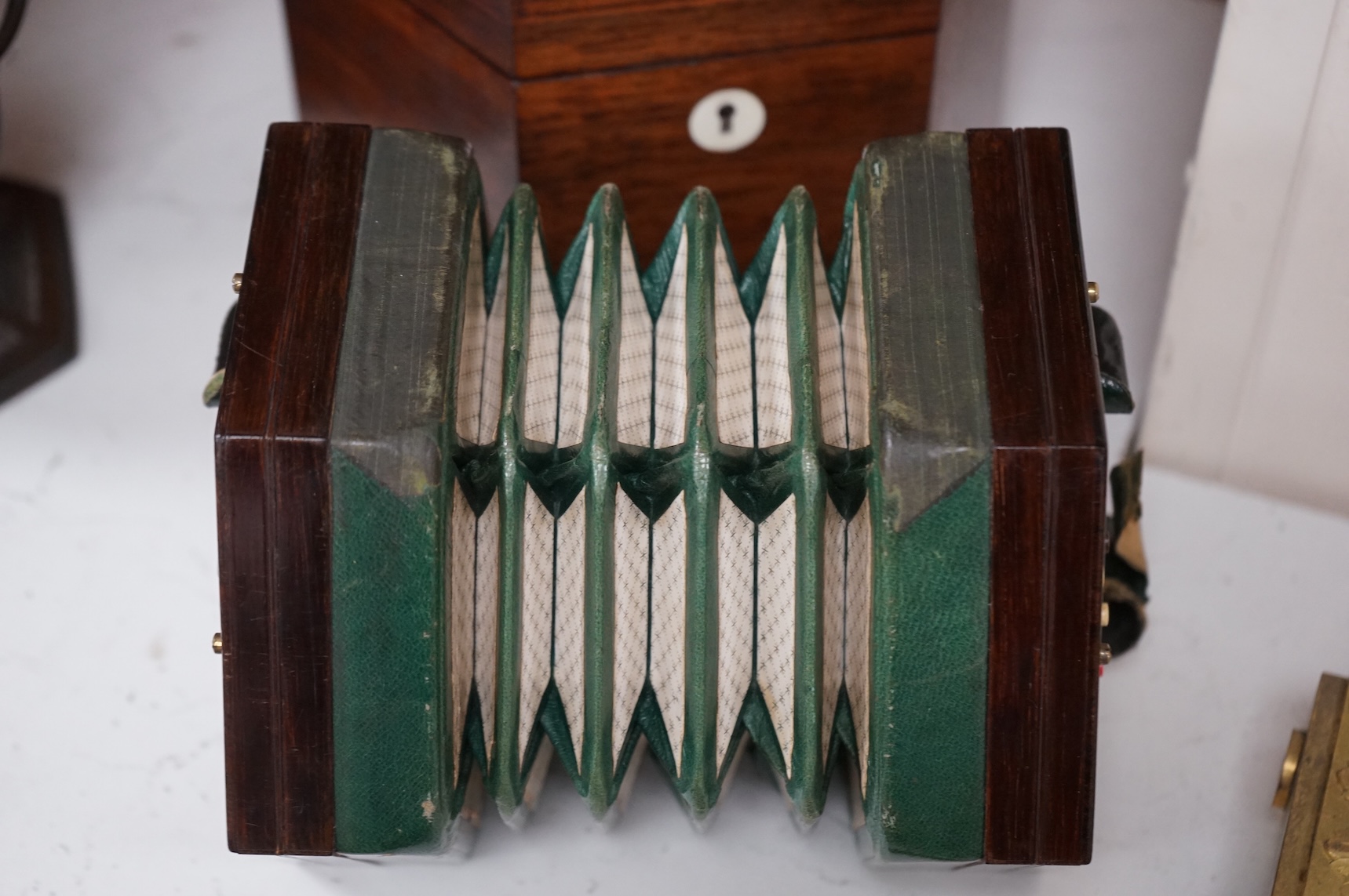 A Wheatstone concertina, in rosewood case, case 16.5cm high. CITES Submission reference, PS7AQEEA